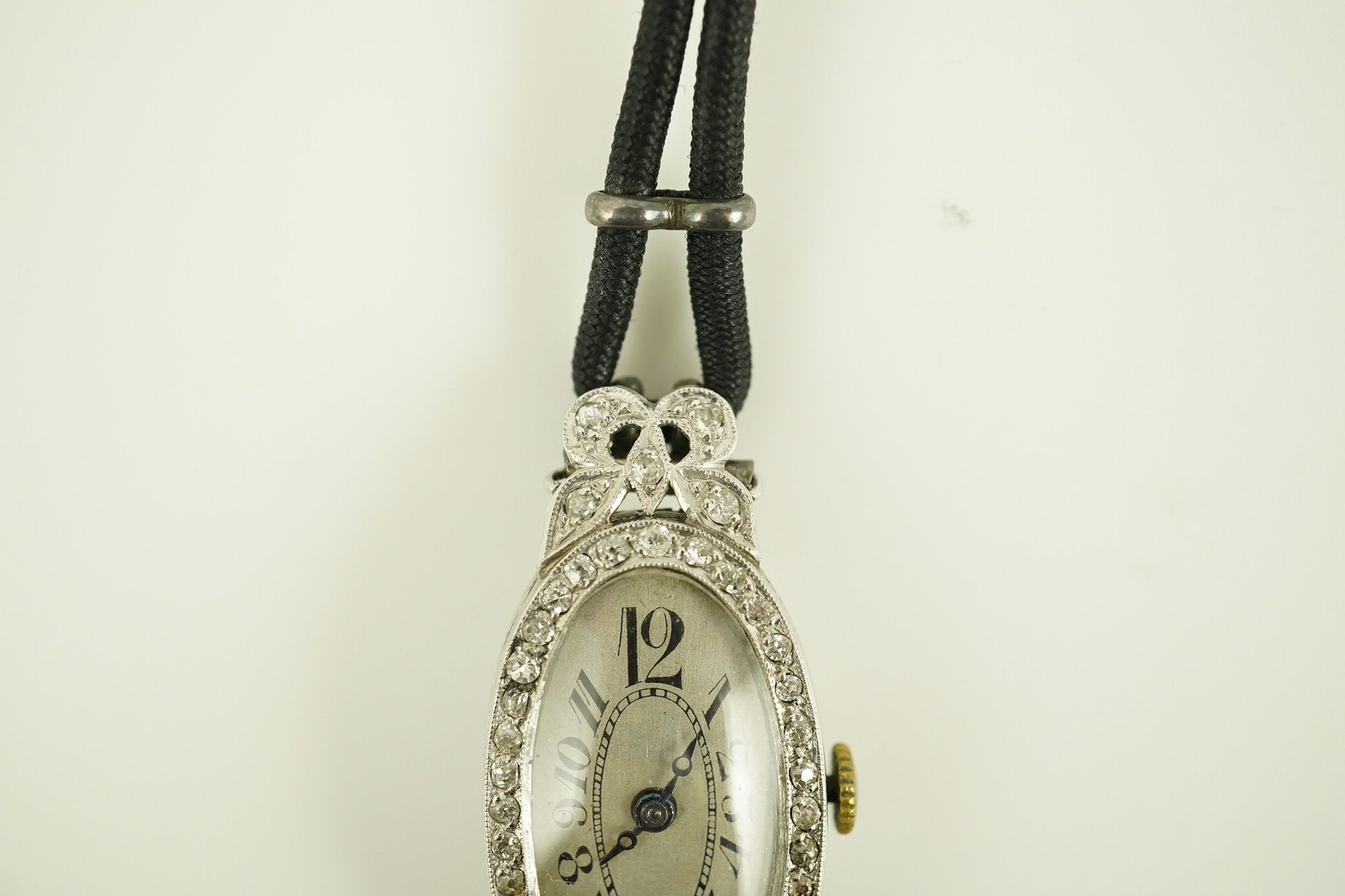 A lady's 1920's/1930's platinum and diamond cluster set cocktail watch